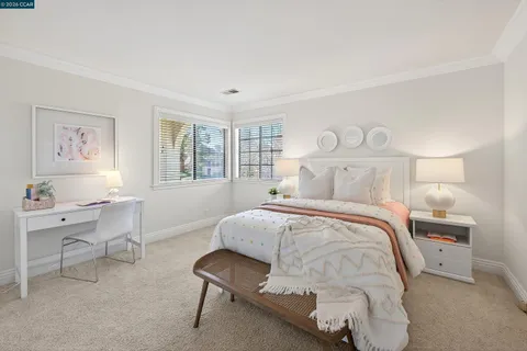 a bedroom with a bed and chair