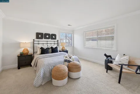 a utility room with cabinets washer and dryer