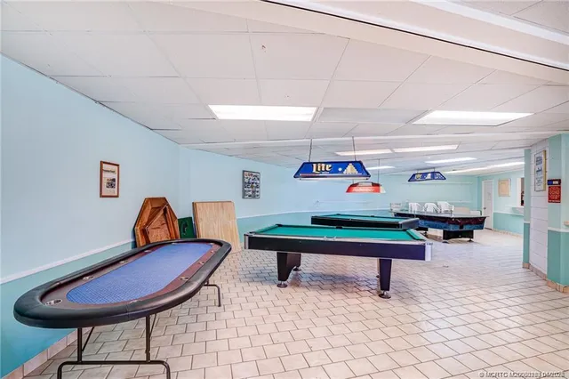 a room with furniture and air hockey table