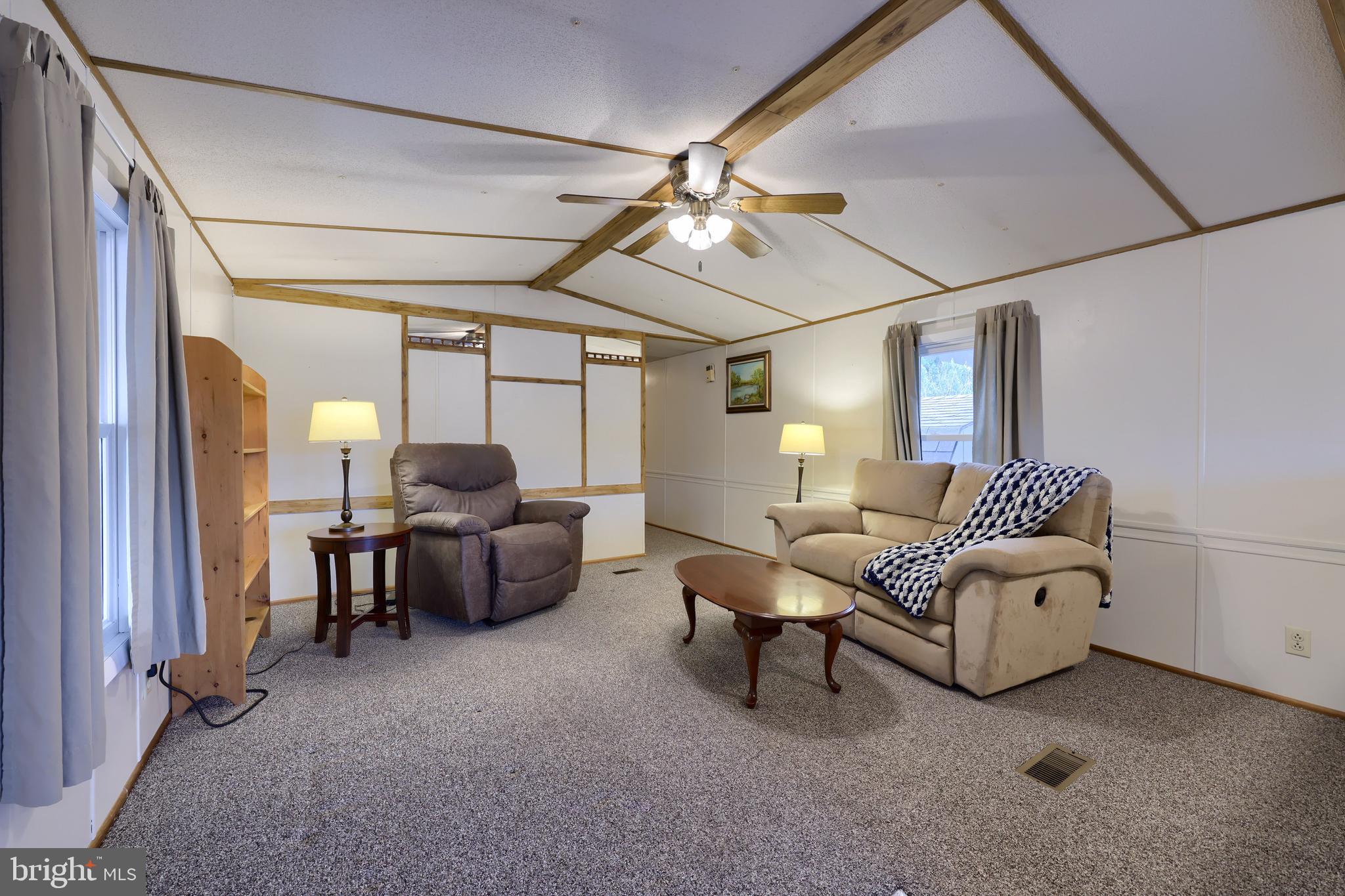 123 Ridgewood Manor Manheim, PA 17545 - Photo 11 of 25 a living room with furniture and a chandelier