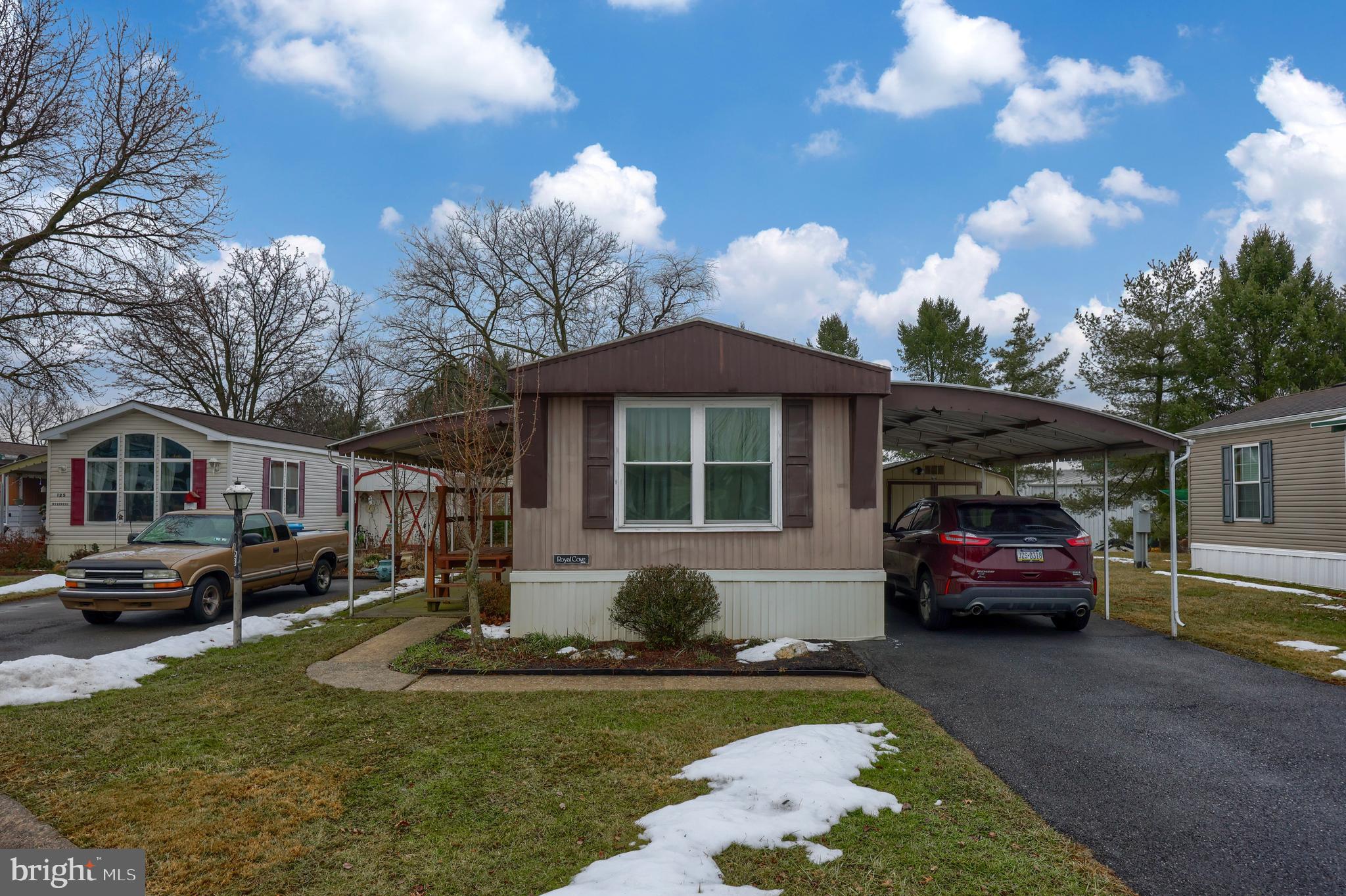 123 Ridgewood Manor Manheim, PA 17545 - Photo 2 of 25 a front view of a house with a garden