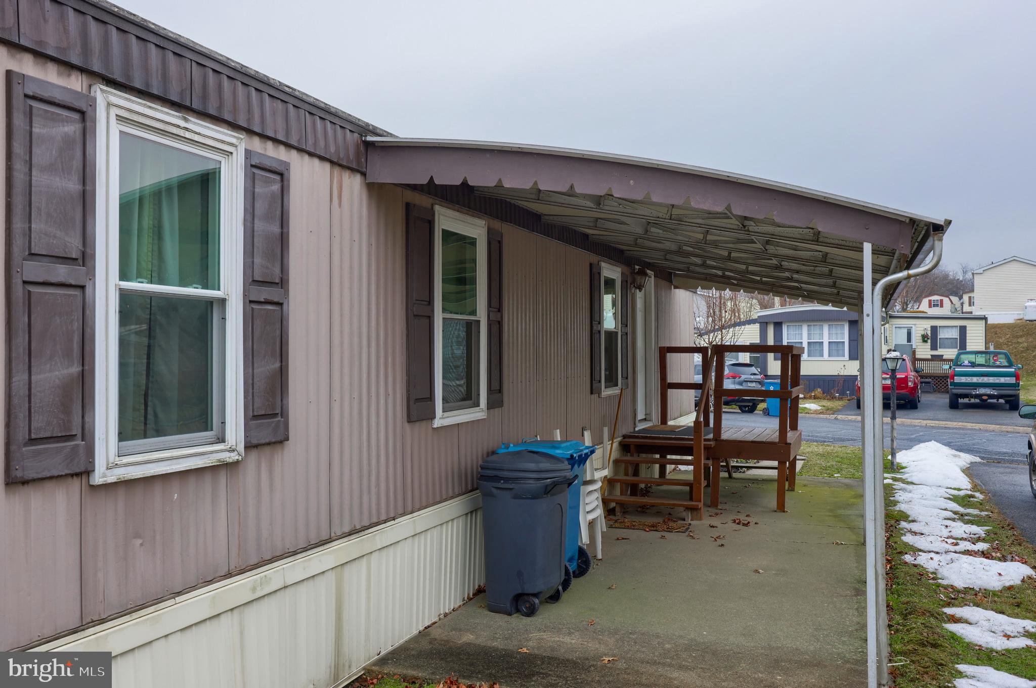 123 Ridgewood Manor Manheim, PA 17545 - Photo 22 of 25 a view of a porch with furniture and floor to ceiling window