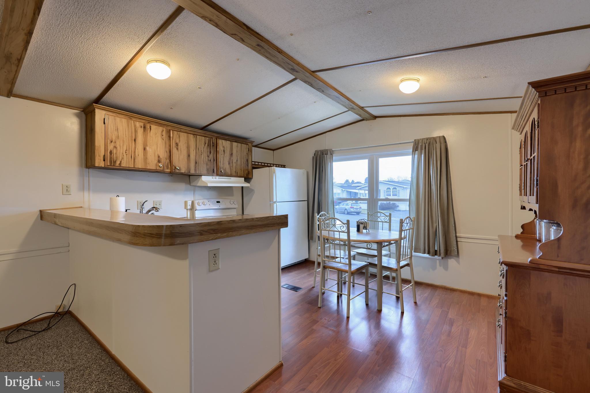 123 Ridgewood Manor Manheim, PA 17545 - Photo 5 of 25 a kitchen with a sink cabinets and wooden floor