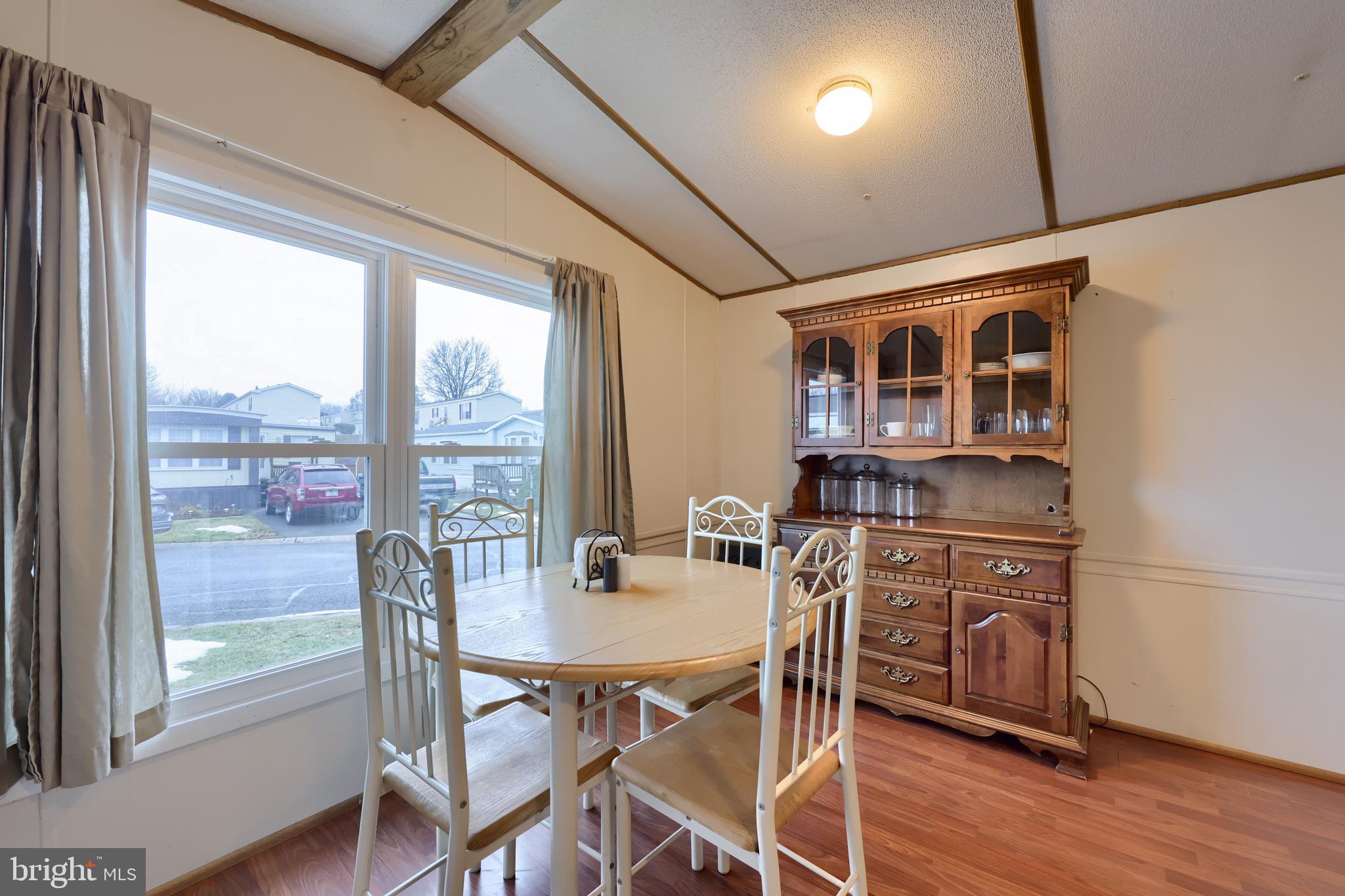 123 Ridgewood Manor Manheim, PA 17545 - Photo 9 of 25 a view of a dining room with furniture window and wooden floor