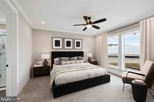 a bedroom with a large bed and a window