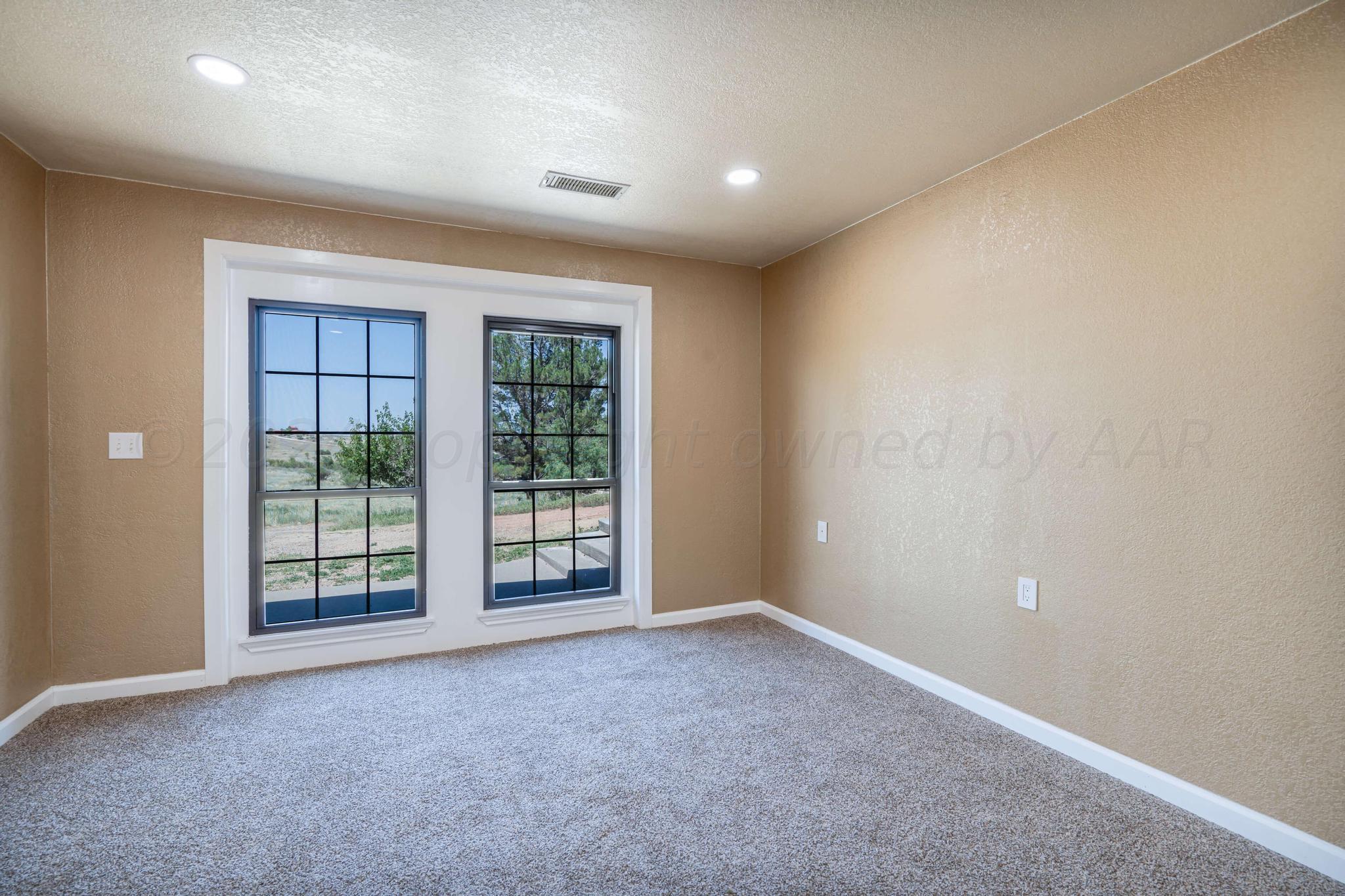 11601 East View Drive Amarillo, TX 79124 - Photo 12 of 20 an empty room with windows and view