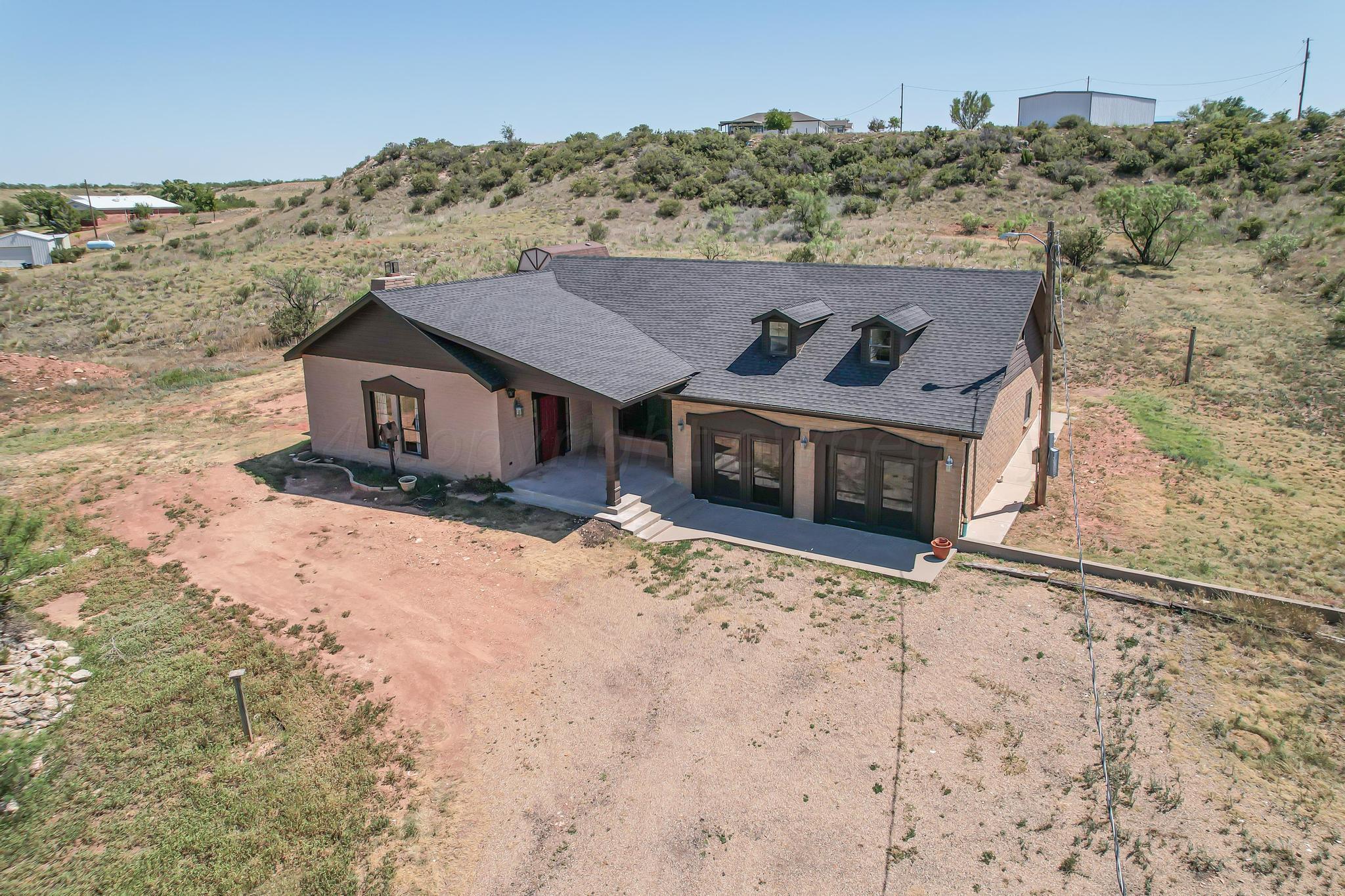 11601 East View Drive Amarillo, TX 79124 - Photo 2 of 20 front view of a house with a yard