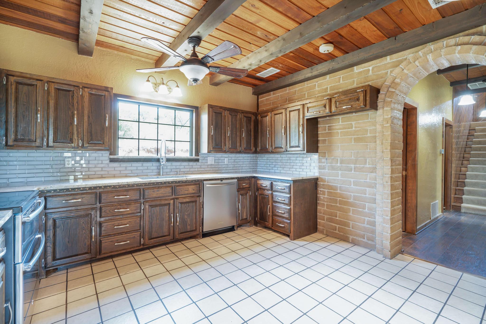 11601 East View Drive Amarillo, TX 79124 - Photo 9 of 20 a kitchen with a sink cabinets and window
