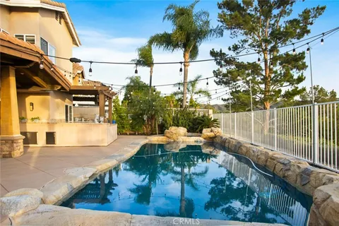 a view of a house with pool table and chairs
