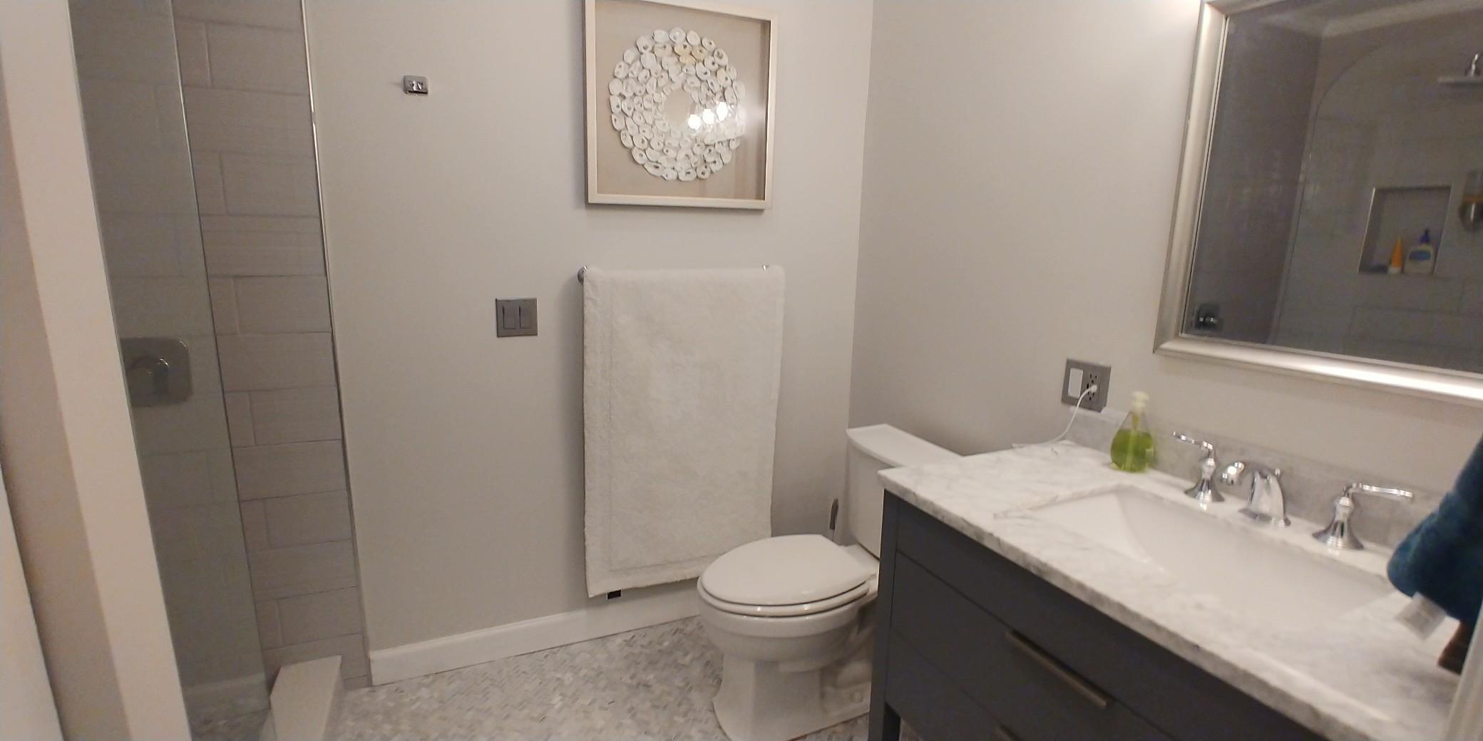 17042 Traverse Circle Jupiter, FL 33477 - Photo 26 of 30 a bathroom with a sink a toilet and shower