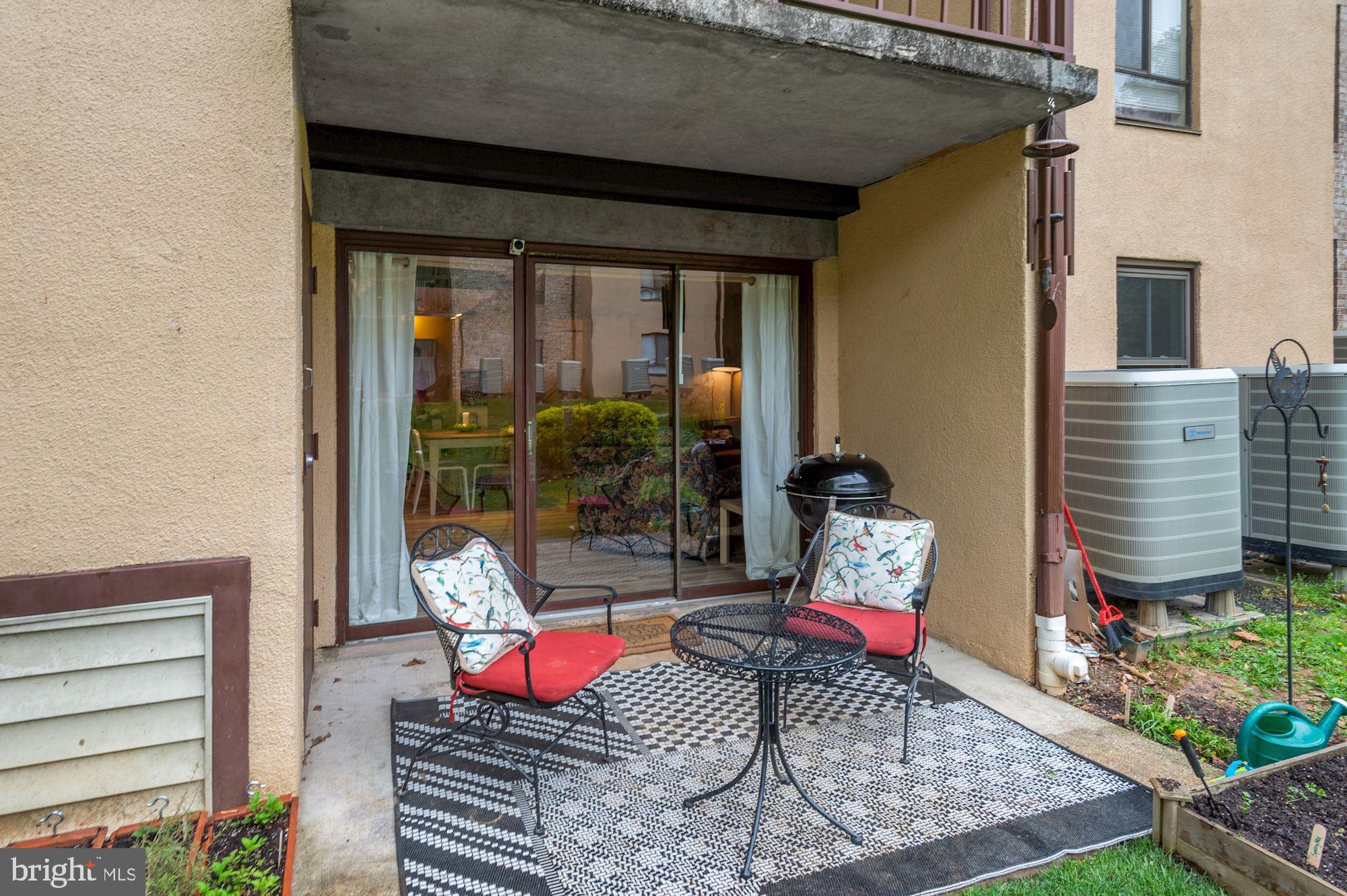 2228 Castle Rock Square, Unit 1B Reston, VA 20191 - Photo 18 of 21 Outdoor patio off of kitchen/living room