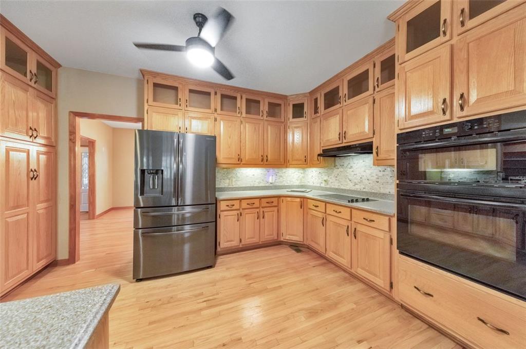 5940 Old Stilesboro Road Northwest Acworth, GA 30101 - Photo 24 of 61 a kitchen with stainless steel appliances granite countertop a refrigerator a stove and a sink