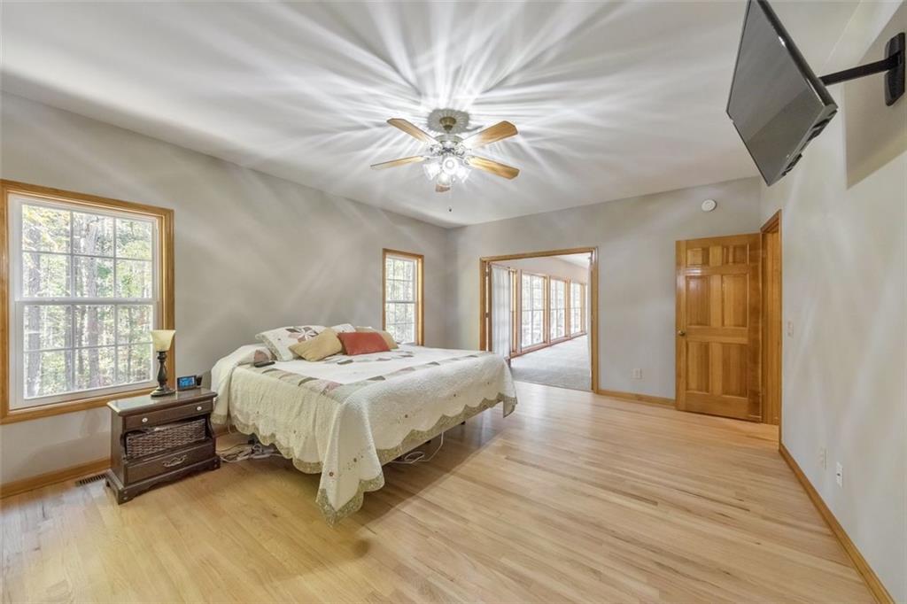 5940 Old Stilesboro Road Northwest Acworth, GA 30101 - Photo 30 of 61 a bedroom with a bed and a chandelier