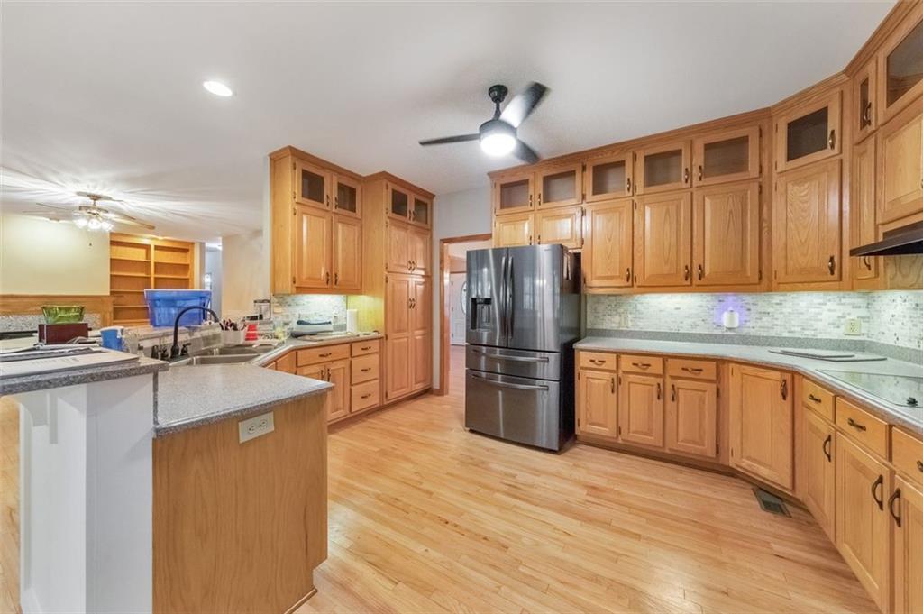 5940 Old Stilesboro Road Northwest Acworth, GA 30101 - Photo 3 of 61 a kitchen with stainless steel appliances granite countertop a refrigerator a sink dishwasher a stove with wooden cabinets and floor