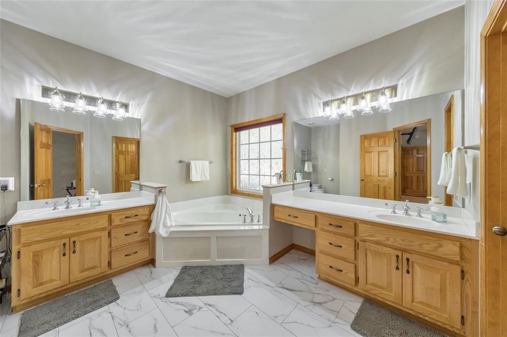 5940 Old Stilesboro Road Northwest Acworth, GA 30101 - Photo 31 of 61 a spacious bathroom with a granite countertop sink mirror and bathtub