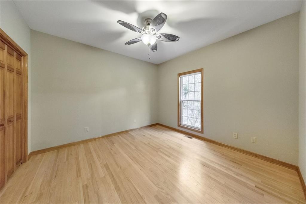 5940 Old Stilesboro Road Northwest Acworth, GA 30101 - Photo 33 of 61 an empty room with windows and ceiling fan