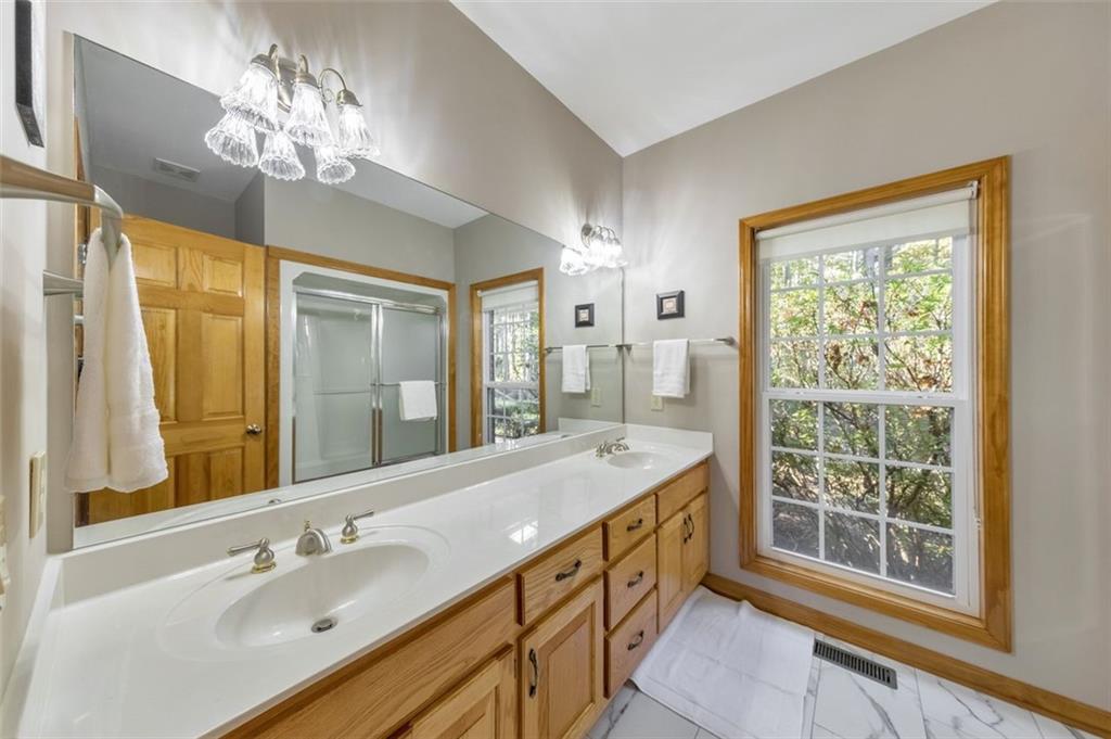 5940 Old Stilesboro Road Northwest Acworth, GA 30101 - Photo 35 of 61 a bathroom with a double vanity sink and a mirror