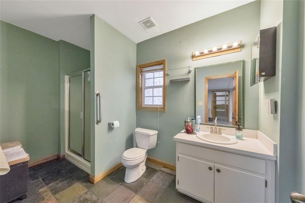 5940 Old Stilesboro Road Northwest Acworth, GA 30101 - Photo 44 of 61 a bathroom with a toilet sink and mirror