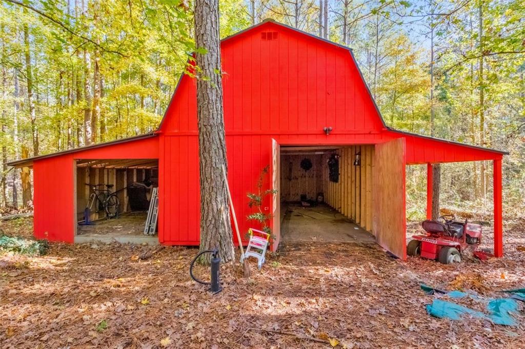 5940 Old Stilesboro Road Northwest Acworth, GA 30101 - Photo 50 of 61 a view of a tall room with a small yard and a wooden fence