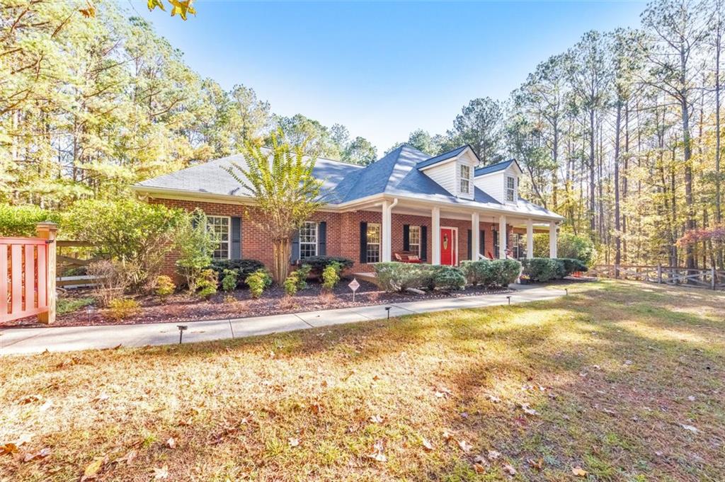 5940 Old Stilesboro Road Northwest Acworth, GA 30101 - Photo 51 of 61 a front view of a house with swimming pool and porch with furniture