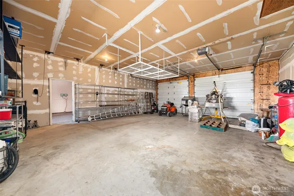 a view of parking garage with cars