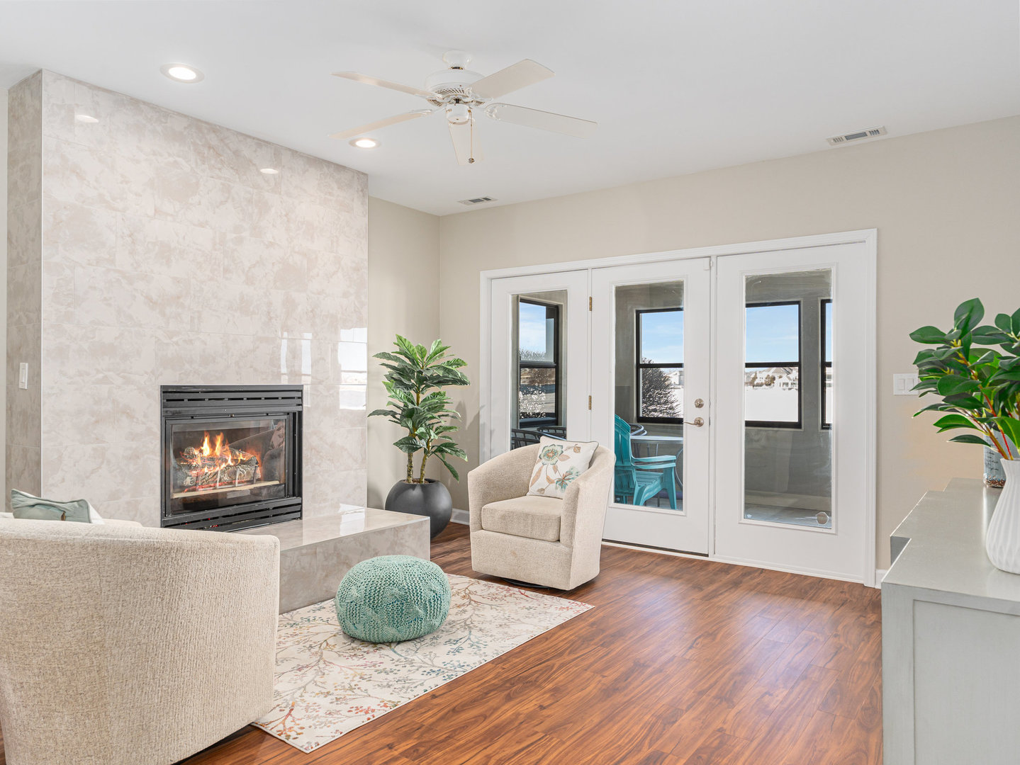 23024 Pilcher Road Plainfield, IL 60544 - Photo 19 of 56 a living room with fireplace furniture and a potted plant