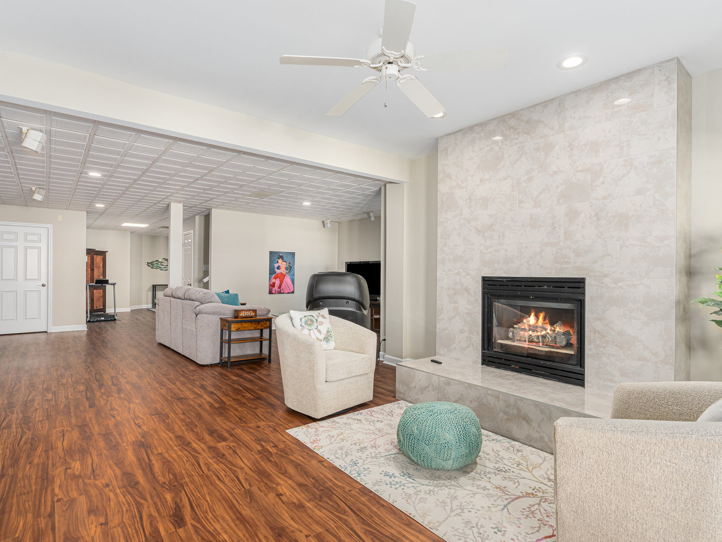 23024 Pilcher Road Plainfield, IL 60544 - Photo 20 of 56 a living room with fireplace furniture and a wooden floor