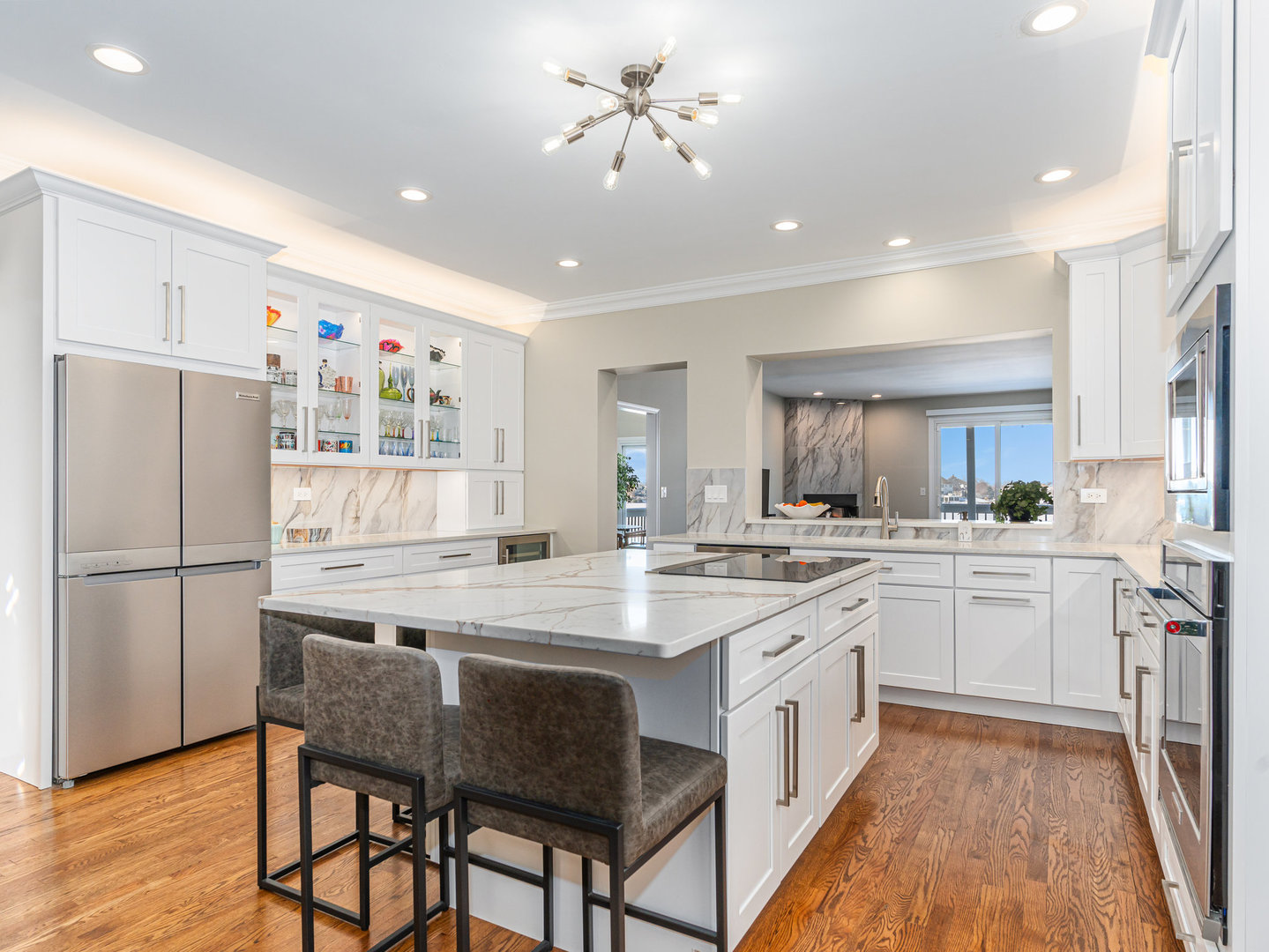23024 Pilcher Road Plainfield, IL 60544 - Photo 5 of 56 a kitchen with a white cabinets and white appliances
