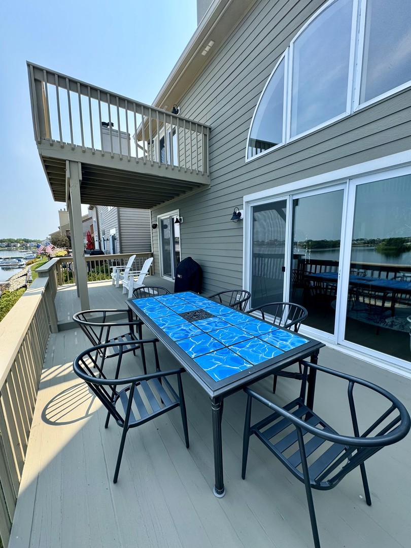 23024 Pilcher Road Plainfield, IL 60544 - Photo 52 of 56 a view of a chairs and table in the patio