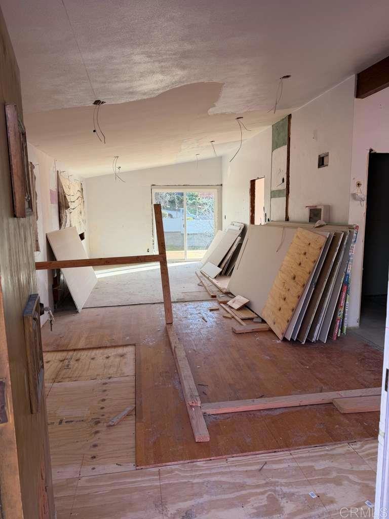 3536 Ybarra Road Spring Valley, CA 91978 - Photo 18 of 42 a bedroom with a bed and wooden floor