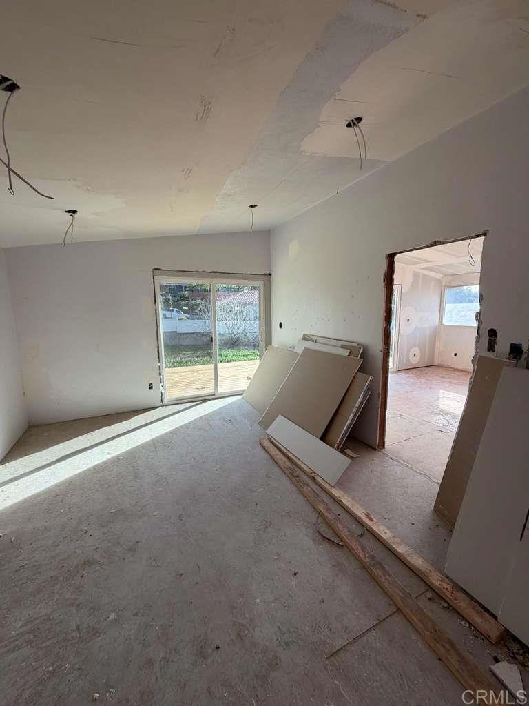 3536 Ybarra Road Spring Valley, CA 91978 - Photo 26 of 42 a bed room with a bed and a large window