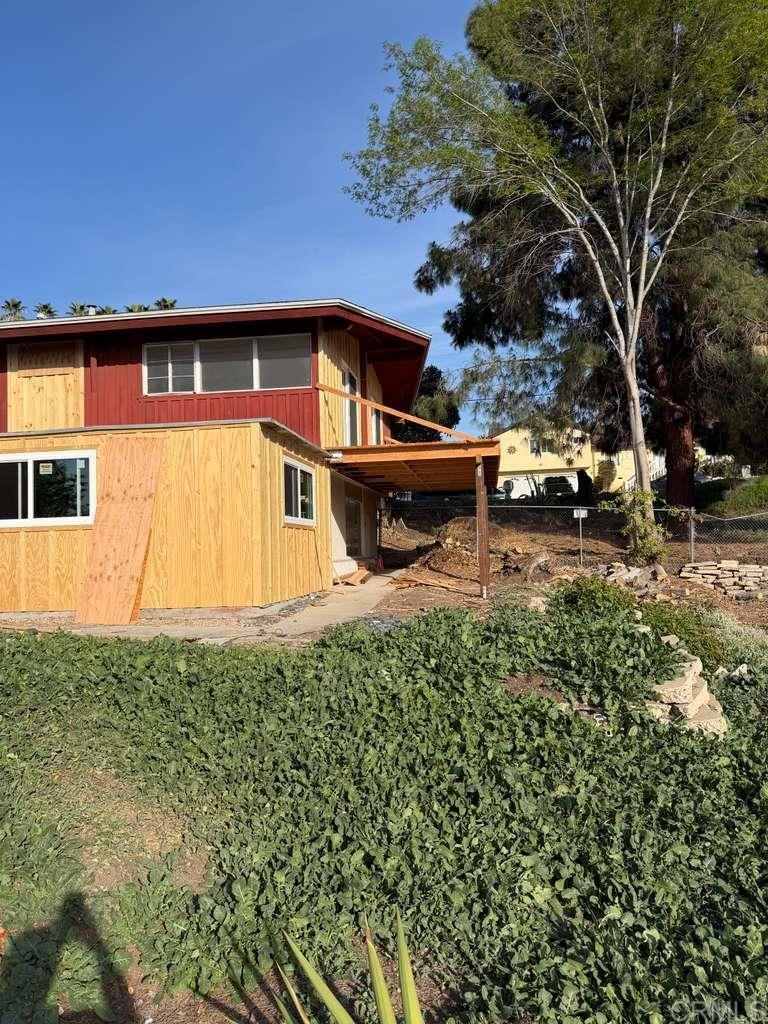3536 Ybarra Road Spring Valley, CA 91978 - Photo 4 of 42 a front view of a house with a yard