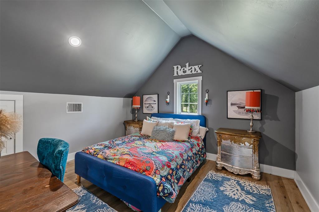 16241 Big Oak Bay Road Tyler, TX 75707 - Photo 27 of 40 Vaulted ceiling with recessed lighting, wood-finish flooring, white trim, and a window with natural light