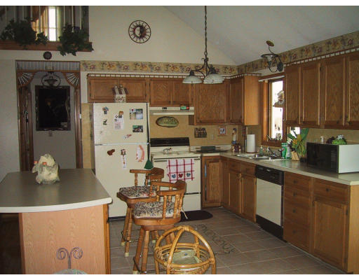 76 Vann Street Springfield, MA 01119 - Photo 4 of 6 a kitchen with stainless steel appliances a stove a sink cabinets and a dining table