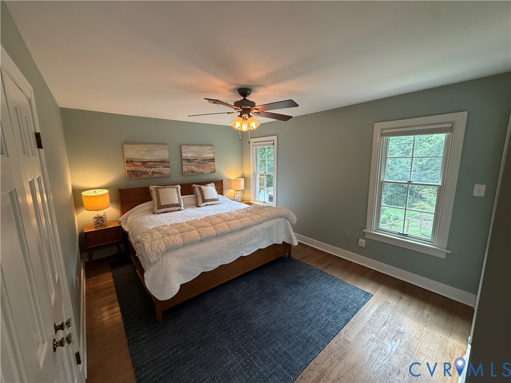 2312 Judes Ferry Road Powhatan, VA 23139 - Photo 24 of 38 Bedroom featuring warm wood-finish flooring, light
