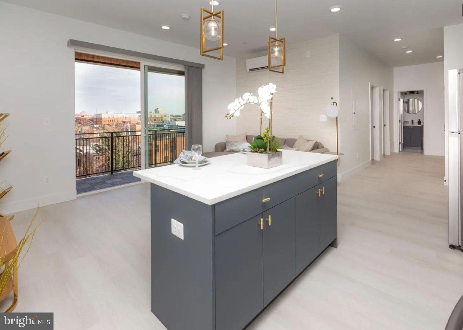 520 South Caroline Street, Unit 405 Baltimore, MD 21231 - Photo 1 of 18 a kitchen with a sink cabinets and wooden floor