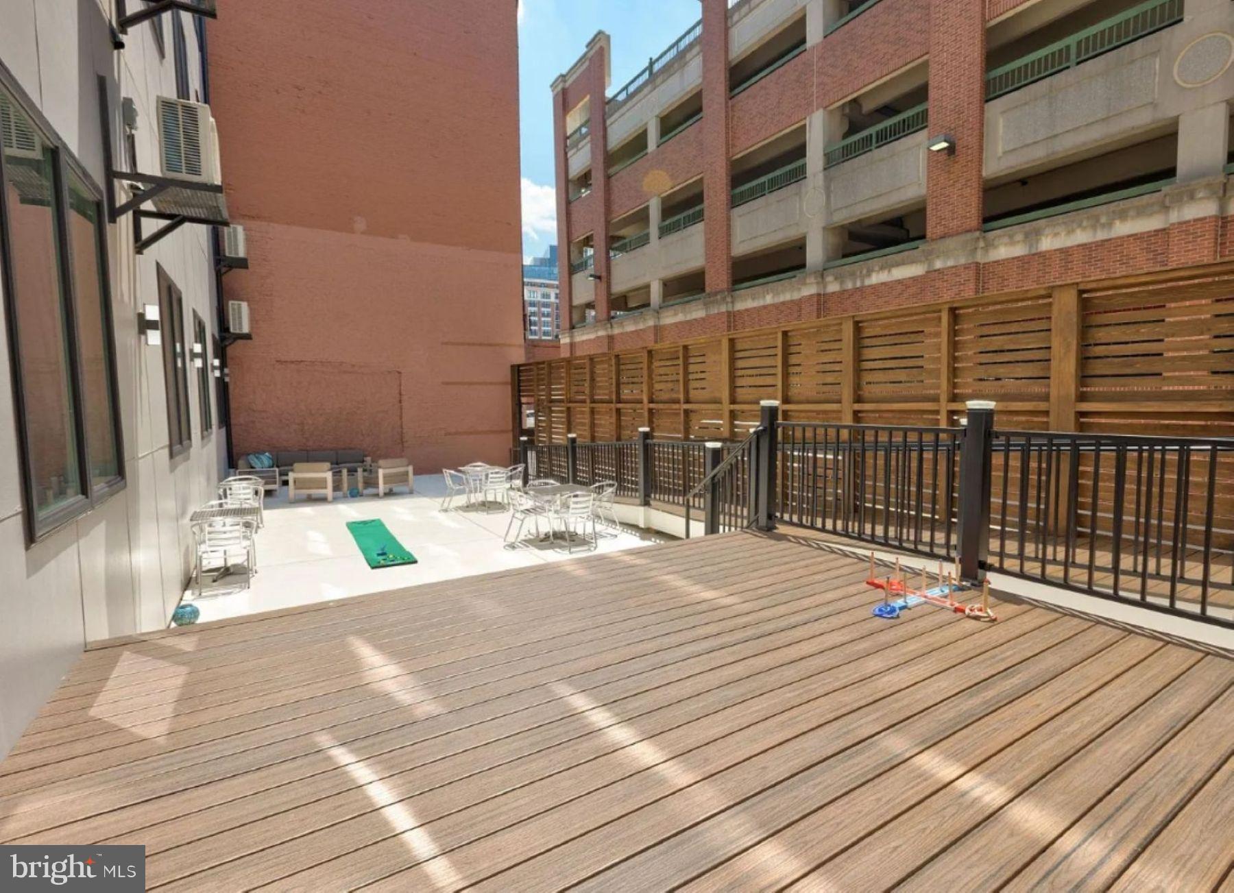 520 South Caroline Street, Unit 405 Baltimore, MD 21231 - Photo 16 of 18 a swimming pool with outdoor seating