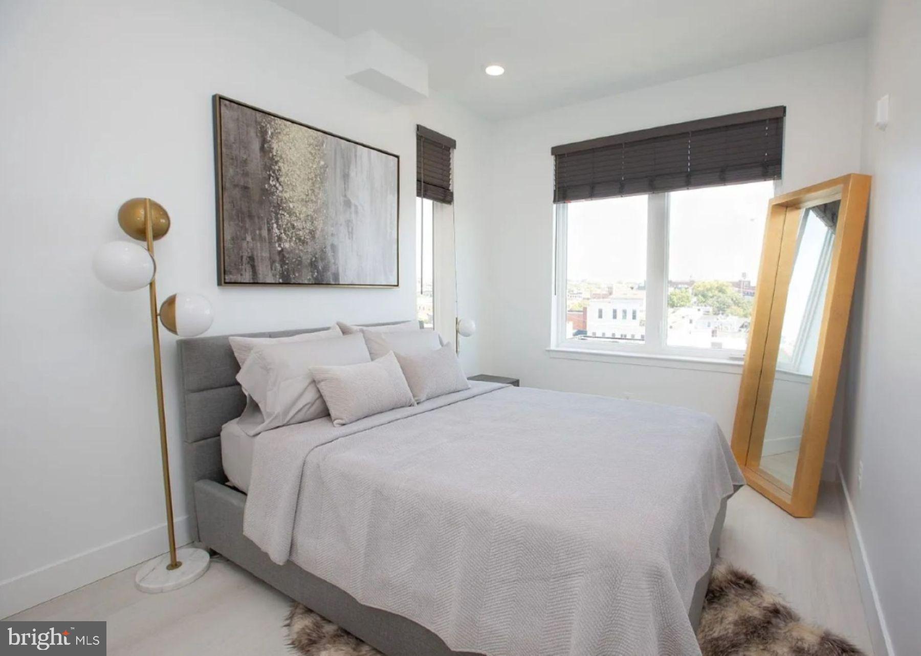 520 South Caroline Street, Unit 405 Baltimore, MD 21231 - Photo 5 of 18 a bedroom with a bed and a window