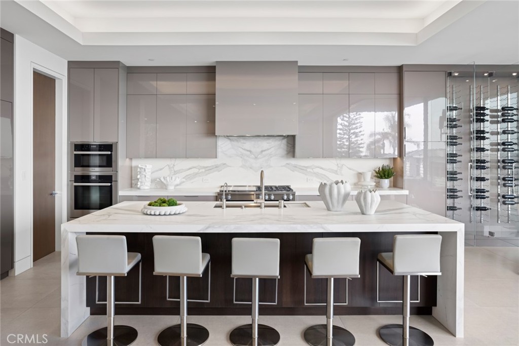 304 Poppy Avenue Corona del Mar, CA 92625 - Photo 12 of 35 a view of a dining room with furniture and wooden floor