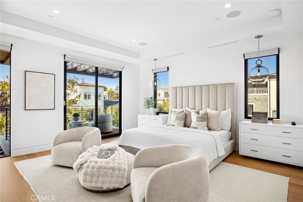 304 Poppy Avenue Corona del Mar, CA 92625 - Photo 17 of 35 a bedroom with bed and large windows