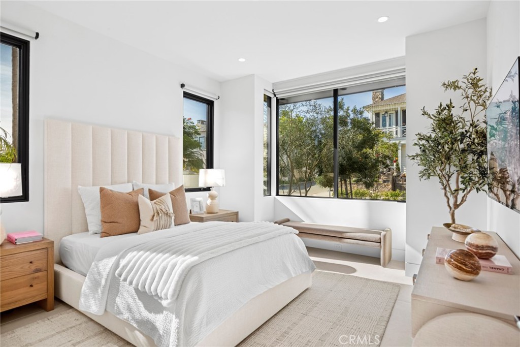 304 Poppy Avenue Corona del Mar, CA 92625 - Photo 24 of 35 a bedroom with a bed and a large window with outer view