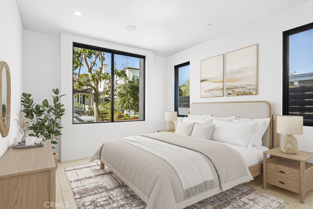 304 Poppy Avenue Corona del Mar, CA 92625 - Photo 7 of 35 a bedroom with a large bed and a window