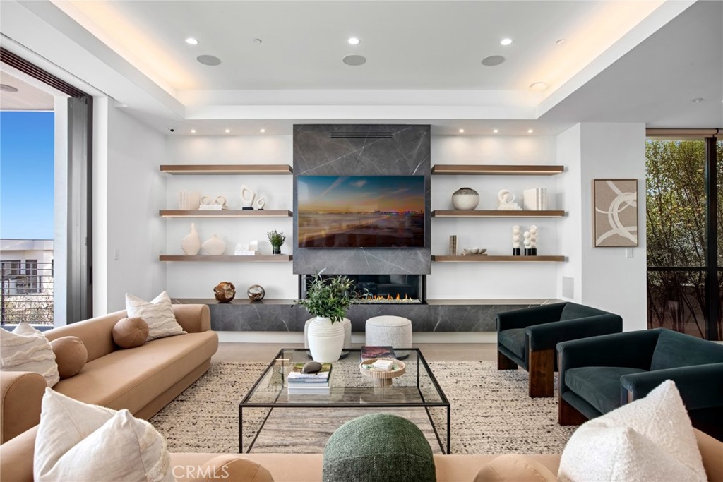 304 Poppy Avenue Corona del Mar, CA 92625 - Photo 10 of 35 a living room with furniture and a kitchen area
