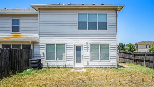 a view of a house with swimming pool in front of it