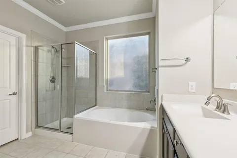 a white bath tub sitting next to a white sink