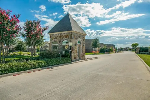 a view of a street with a building in the background