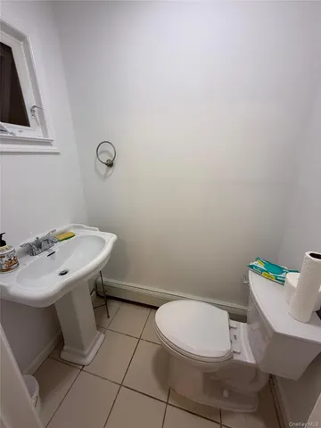 a bathroom with a sink a toilet a mirror and vanity