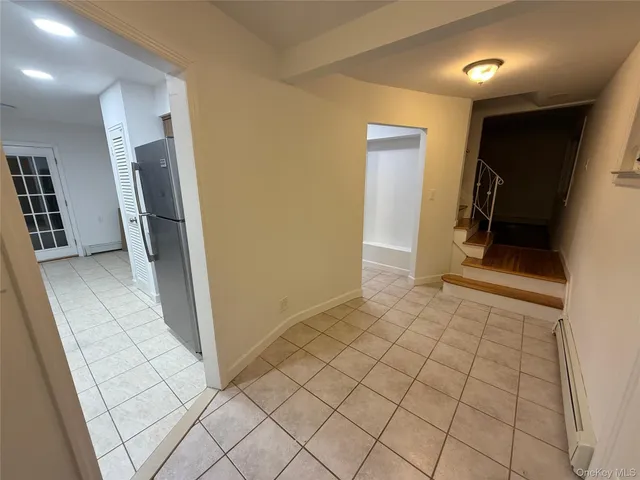 a view of room with wooden floor