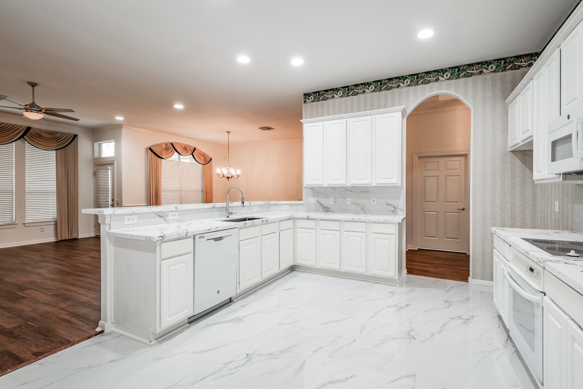 43 North Belfair Place Spring, TX 77382 - Photo 15 of 36 a large bathroom with a granite countertop sink a toilet a mirror and vanity