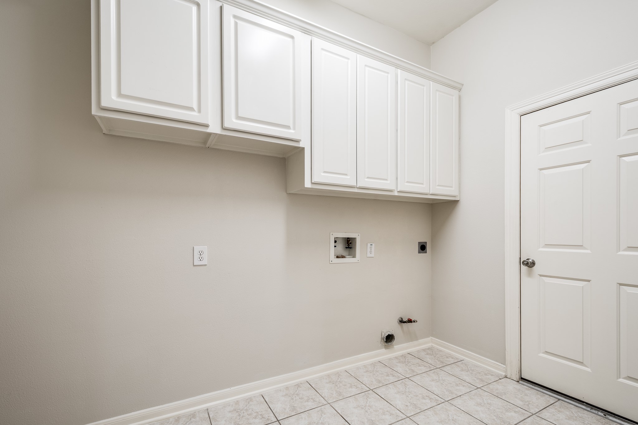 43 North Belfair Place Spring, TX 77382 - Photo 27 of 36 a view of kitchen with white cabinets